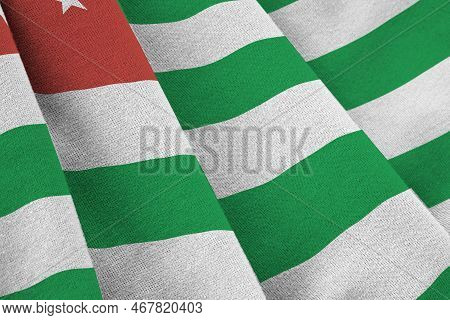 Abkhazia Flag With Big Folds Waving Close Up Under The Studio Light Indoors. The Official Symbols An