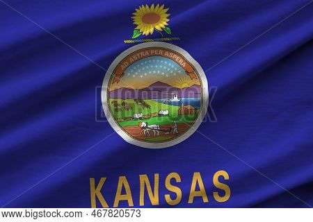 Kansas Us State Flag With Big Folds Waving Close Up Under The Studio Light Indoors. The Official Sym