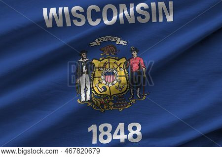 Wisconsin Us State Flag With Big Folds Waving Close Up Under The Studio Light Indoors. The Official 