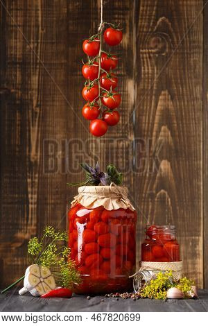Pickled Cherry Tomatoes With Garlic, Dill And Spices. Homemade Food. Canned Tomatoes In Closed And O