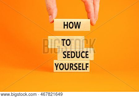 How To Seduce Yourself Symbol. Concept Word How To Seduce Yourself On Wooden Blocks. Businessman Han