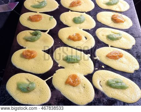 Closeup Of Thai Dessert (tokyo Sweets, Tokyo Desserts, Khanom Tokyo) And Pancakes On A Stove For Str