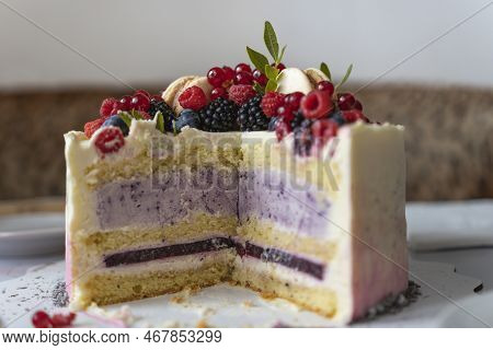 Sponge Cake With Yogurt And Fruit Filling In Section. Delicious Dessert Decorated With Fresh Berries