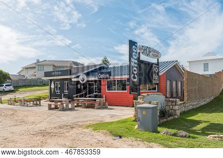 Struisbaai, South Africa - Sep 21, 2022: Street Scene, With A Fish And Chips And Coffee Shop, In Str