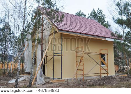 White Upvc Fascia Boards Installation Along The Roofline Of The House. New House With Metal Roof, Pa