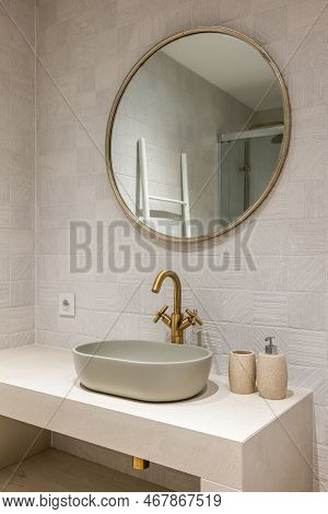 Neat Stylish Oval-shaped Sink On White Marble Countertop With An Elegant Copper-coloured Faucet. Abo