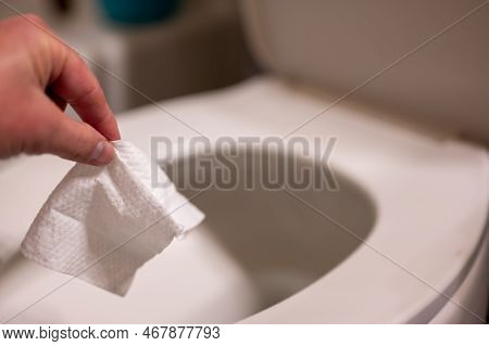 Disposable Wipes Being Flushed Down A Toilet Where They Can Cause Clogging And Problems With Wastewa