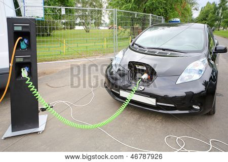 MOSCOW - AUGUST 18: Modern electric car recharged at electrical charging at festival Ekofest 2012 on banks of Stroginsky gulf, on August 18, 2012 in Moscow, Russia.