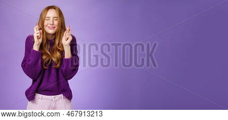 Girl Makes Wish Eager Dream Come True. Atractive Hopeful And Positive Young Redhead Woman In Purple 