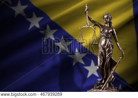 Bosnia And Herzegovina Flag With Statue Of Lady Justice And Judicial Scales In Dark Room. Concept Of
