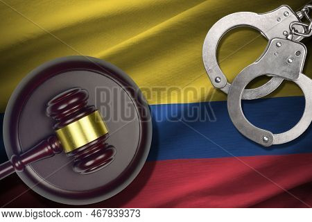 Colombia Flag With Judge Mallet And Handcuffs In Dark Room. Concept Of Criminal And Punishment, Back