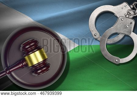 Djibouti Flag With Judge Mallet And Handcuffs In Dark Room. Concept Of Criminal And Punishment, Back