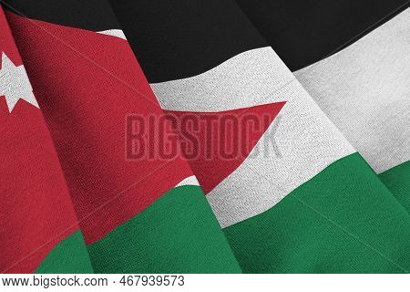 Jordan Flag With Big Folds Waving Close Up Under The Studio Light Indoors. The Official Symbols And 