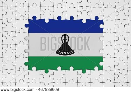 Lesotho Flag In Frame Of White Puzzle Pieces With Missing Central Parts