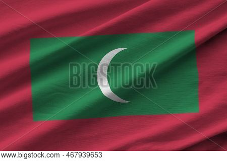 Maldives Flag With Big Folds Waving Close Up Under The Studio Light Indoors. The Official Symbols An