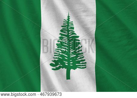 Norfolk Island Flag With Big Folds Waving Close Up Under The Studio Light Indoors. The Official Symb