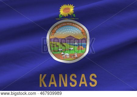 Kansas Us State Flag With Big Folds Waving Close Up Under The Studio Light Indoors. The Official Sym