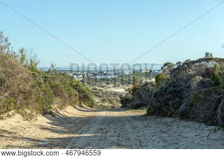 Arniston, South Africa - Sep 22, 2022: Buildings And People Are Visible On The Tral From The Waenhui