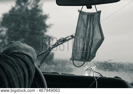 People Have Gotten Into The Habit Of Hanging Covid-19 Masks On The Rearview Mirror Of Their Vehicle'