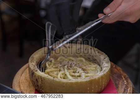 Fresh Pasta With Truffle In Pecorino Cheese Wheel In Restaurant, Florence, Italy