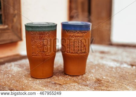 Dresden, Saxony, Germany, 10 December 2022: Clay Cups For Christmas Mulled Wine On Wooden Table In M