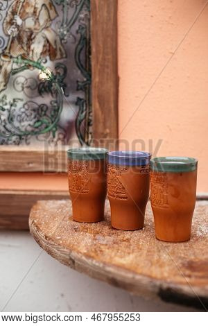 Dresden, Saxony, Germany, 10 December 2022: Clay Cups For Christmas Mulled Wine On Wooden Table In M