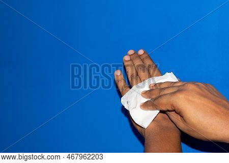 Hygiene, Health Care And Disinfection Concept - Close Up Of Indian Man Cleaning Hands With Antisepti