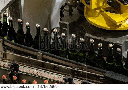 Production Of Cremant Sparkling Wine In Burgundy, France. Automatically Powered Bottling And Corking