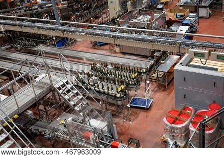 Production Of Cremant Sparkling Wine In Burgundy, France. Automatically Powered Bottling Lines On Fa