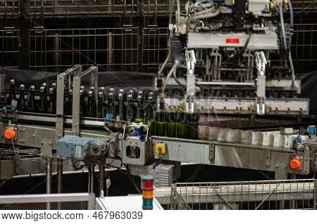 Production Of Cremant Sparkling Wine In Burgundy, France. Automatically Powered Bottling Lines On Fa