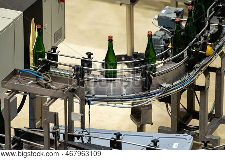 Production Of Cremant Sparkling Wine In Burgundy, France. Automatically Powered Bottling And Corking