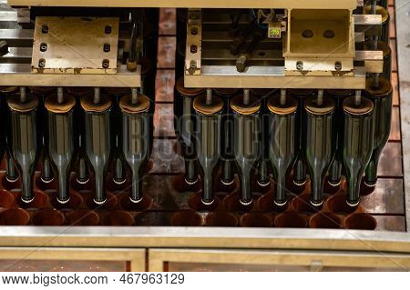 Production Of Cremant Sparkling Wine In Burgundy, France. Automatically Powered Bottling And Riddlin