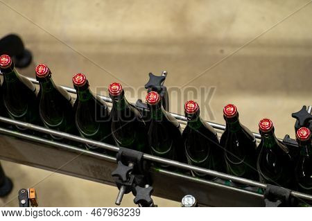 Production Of Cremant Sparkling Wine In Burgundy, France. Automatically Powered Bottling And Corking