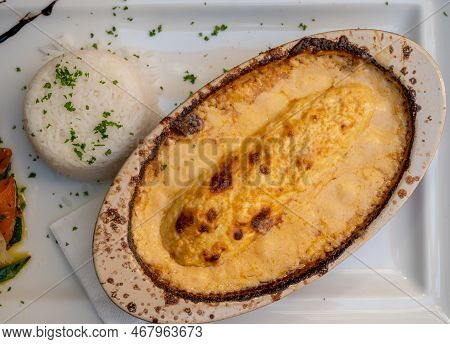 Quenelle, Speciality Of Lyon, Oval-shaped Dumplings Filled With Pike White Fish Served In Creamy Sau
