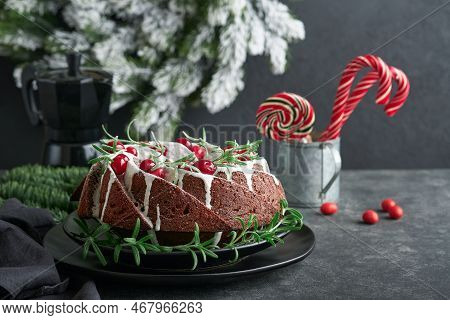 Christmas Chocolate Bundt Cake. Traditional Christmas Fruit Cake With White Glaze, Cranberries And R