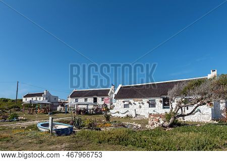 Arniston, South Africa - Sep 22, 2022: A Street Scene, With Willeens Art Craft And Restaurant, And K