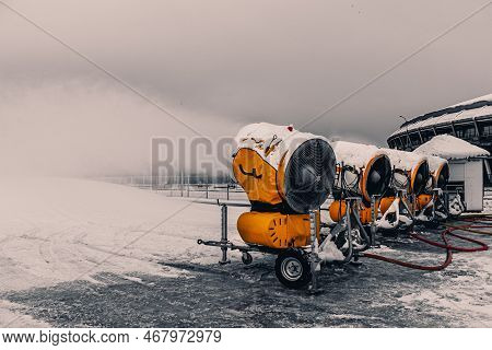 Snow Cannons Spray Artificial Snow Crystals. Snow Guns. Production Of Artificial Snow. Cars Make Sno