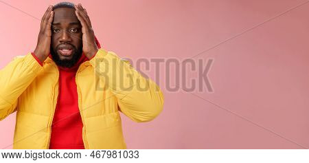 Shocked Upset African-american Bearded Guy Feel Regret Stunned Hear Terrible News Hold Hands Head Wi