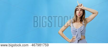 Waist-up Shot Of Stylish Self-assured Woman With Tattoo Feeling Like Winner Mocking Over Losers Stic