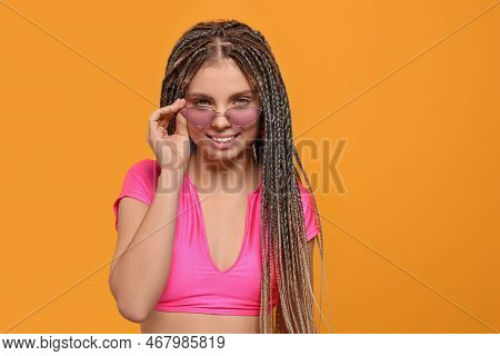 Beautiful Woman With Long African Braids On Yellow Background, Space For Text