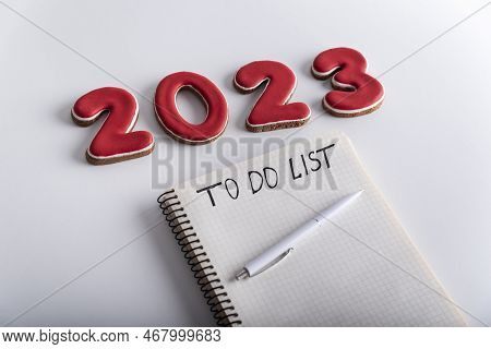 Notepad With Inscription To Do List Pen And Numbers 2023 On White Background. Close Up. Plans And Go