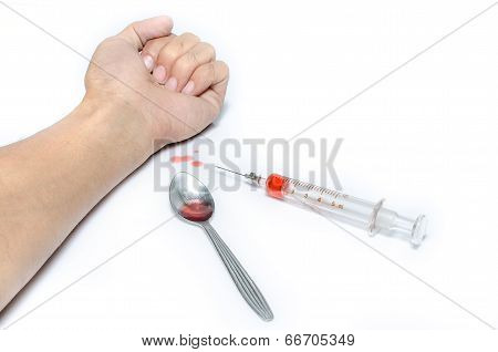 Hand With Heroin Syringe. Close-up Photo.