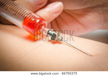 Hand With Heroin Syringe. Close-up Photo.