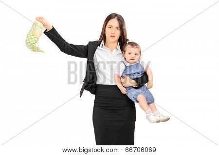 Young mother holding her baby and a stinky diaper isolated on white background