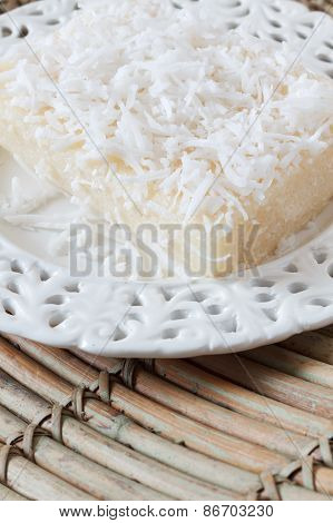 Sweet Couscous Pudding With Coconut On White Vintage Plate On Wooden Table