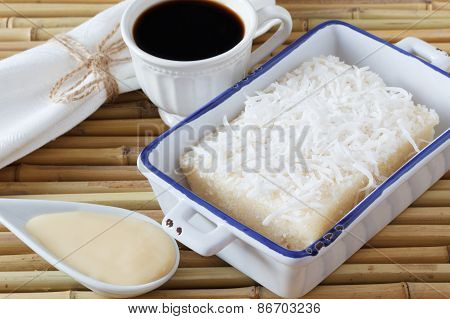 Sweet Couscous (tapioca) Pudding (cuscuz Doce) With Coconut, Cup Of Coffee And Condensed Milk On Bam