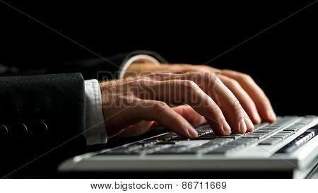Businessman Working On Computer By Typewriting On The Keyboard