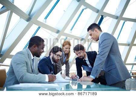 Business partners discussing documents or plan