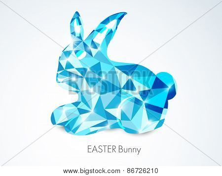Shiny blue crystal rabbit for Happy Easter celebration on shiny grey background.