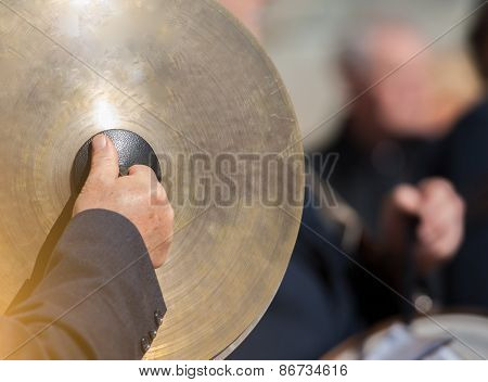 Man Plays The Cymbals During A Religious Cerimony